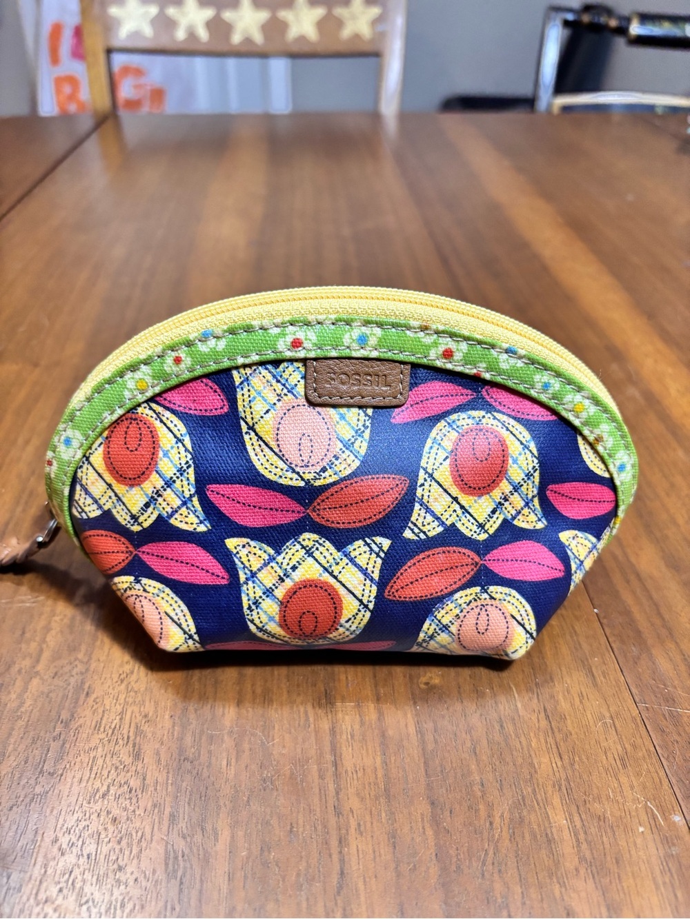 Fossil cosmetic pouch featuring a vibrant navy blue and yellow tulip print